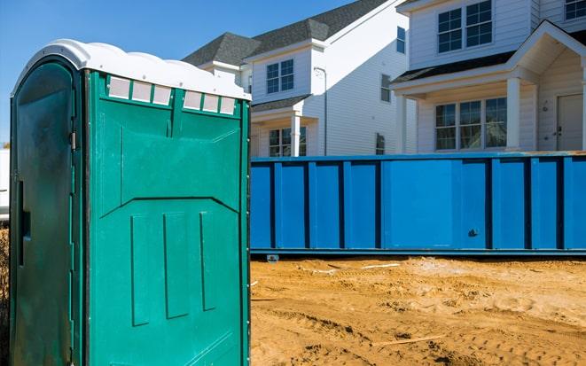 portable toilet and dumpster at a construction site project in Kennesaw GA